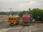 FXE AC4400 Locomotive leading a train and Sperry rail car